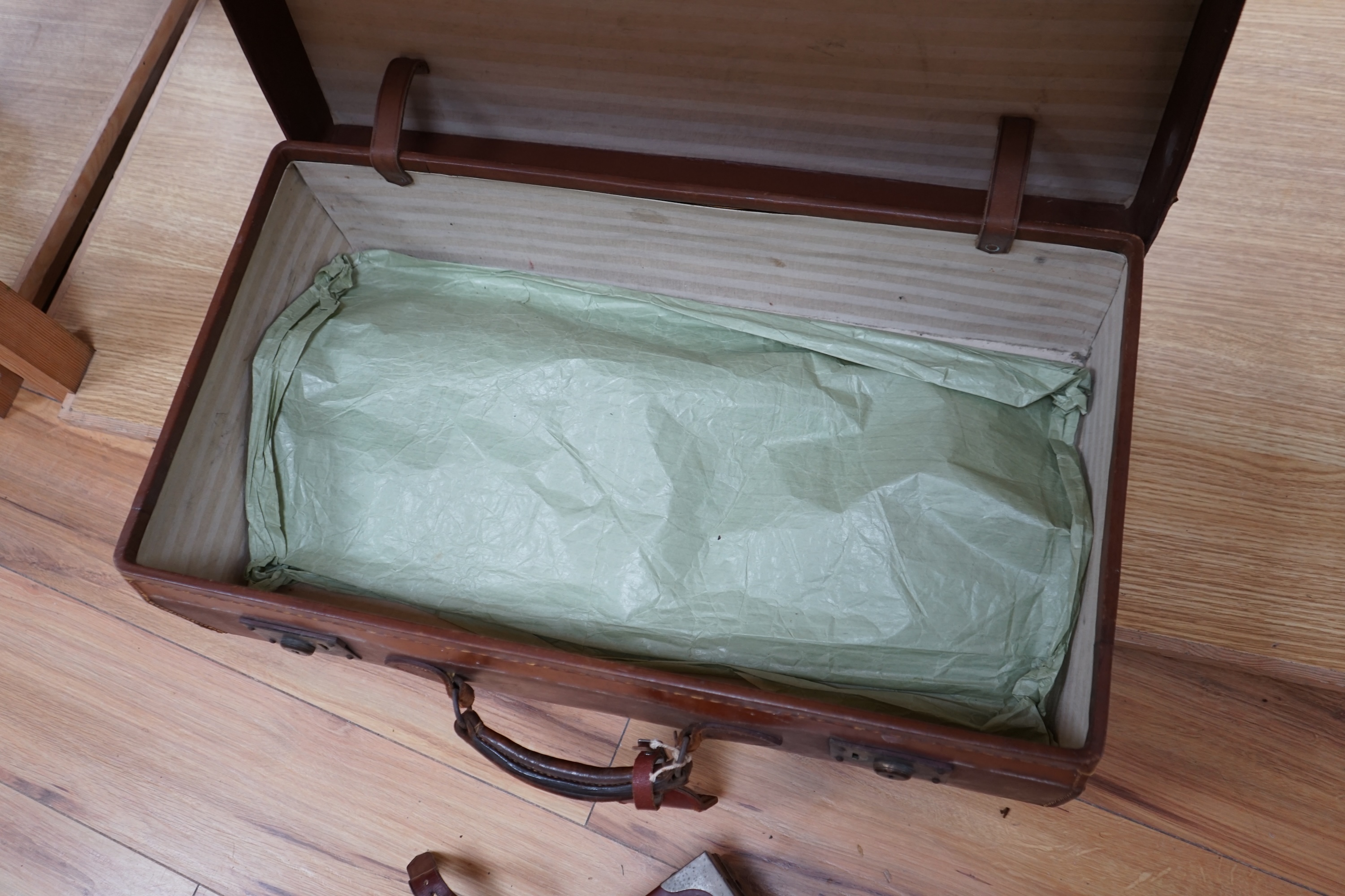 A gun case, various gun cleaning equipment and a brown leather suitcase. Condition - fair